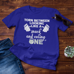 Torn Between Looking Like A Snack And Eating OneIntroducing Torn Between Looking Like A Snack And Eating One Unisex Shirt - the ultimate fitness apparel for anyone looking to reach their goals! This stylish unisexUnisex ShirtslinglyMy StoreTorn